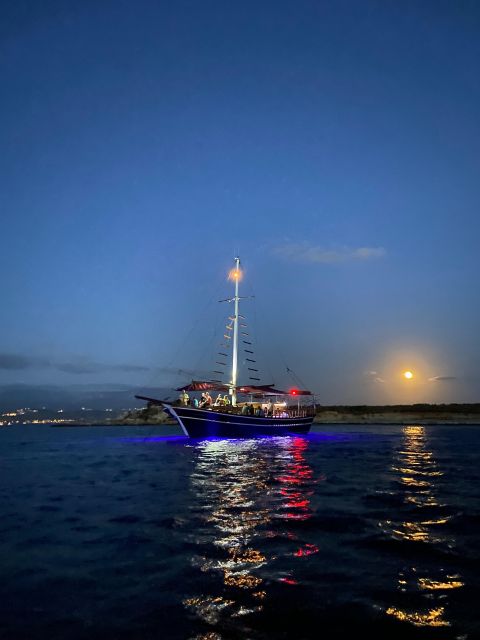 Argostoli: Sunset Cruise with Swim Stops, Dinner, and Wine - Dinner arrives as the sky changes color
