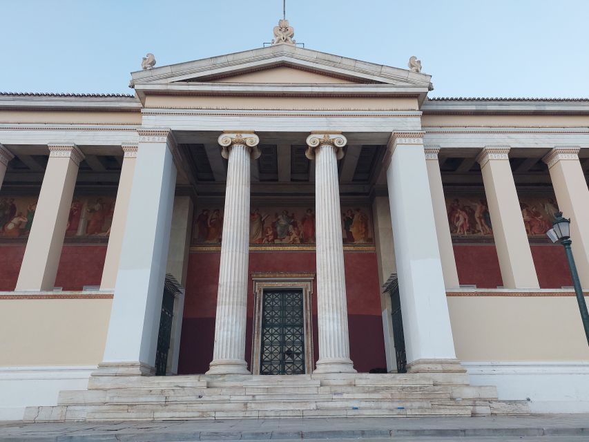 Athens: City Highlights Nighttime Walking Tour in Spanish - Beginning beneath the National Library