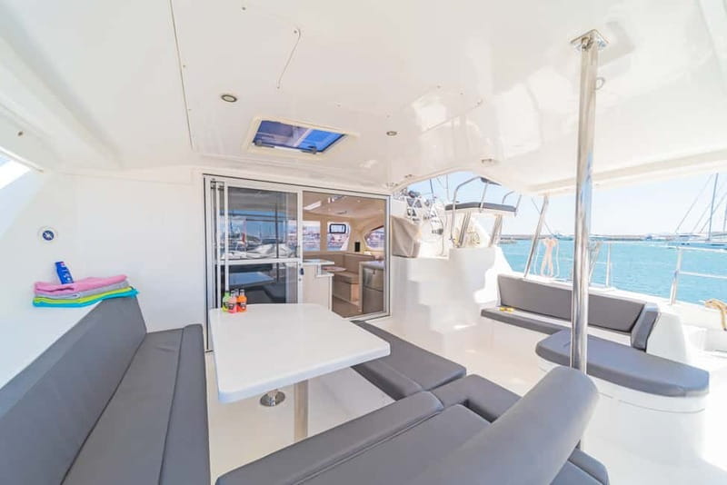 Athens: Half-Day Sunset Catamaran Cruise with Meal & Drinks - Swimming and snorkeling in the Saronic Gulf