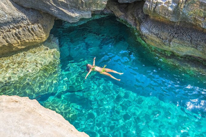 Athens: Island Swimming Day Cruise—DJ, Lunch & Drinks incl. - Metopi: jumping, sliding, and open water