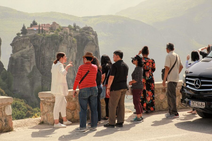 Athens to Meteora: Monasteries & Hidden Caves Bus Tour - Meeting the local guide at Meteora
