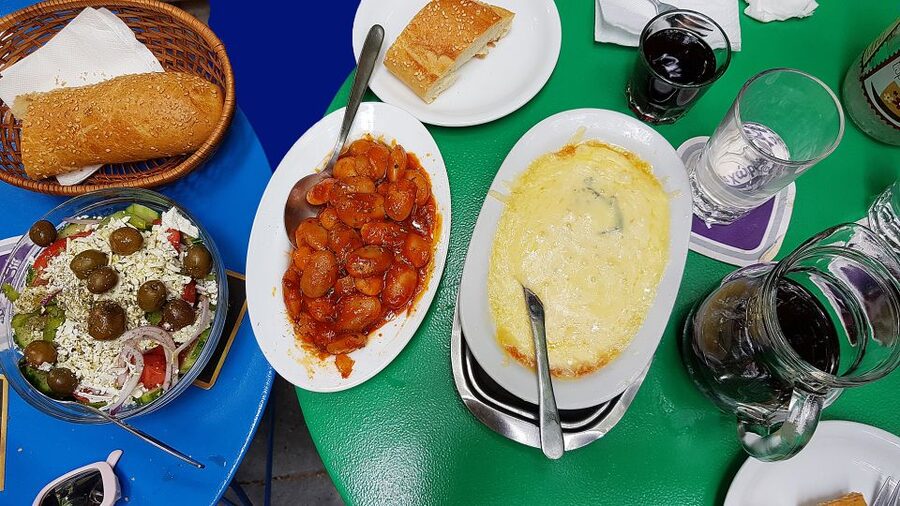 Athens: Traditional Greek food tour in hidden spots - Entering Athens through fish, meat, fruit, and spice markets