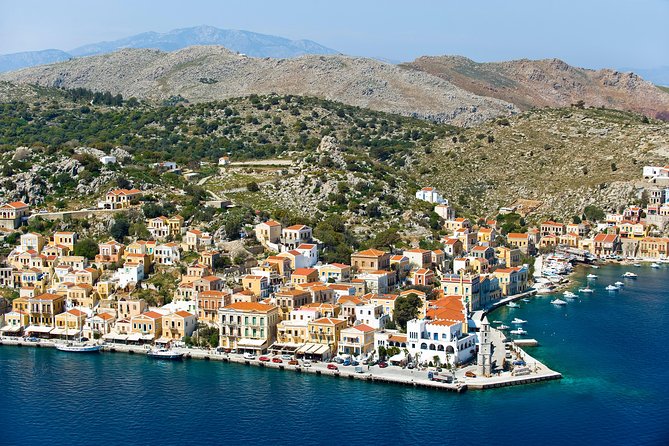 Boat Trip to Symi Island with swimming stop at St George Bay - Symi appears after the swim, and it is worth the wait