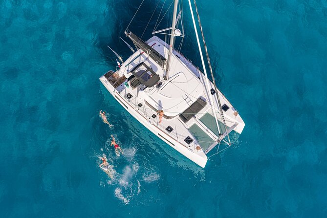 Catamaran Day & Sunset Cruises with meals Drinks and transportation - Rhenia’s clear water is the main event