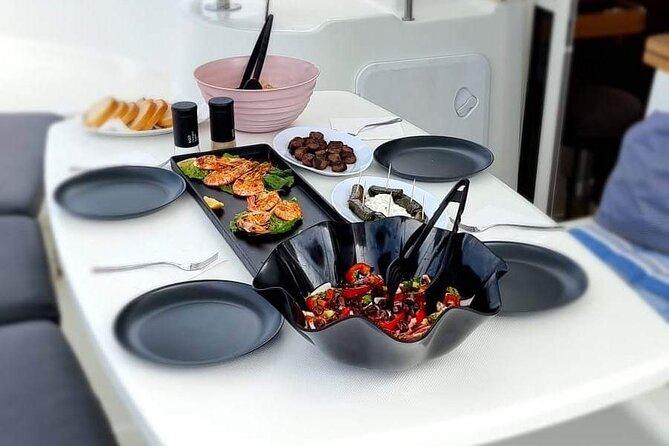 Catamaran Day & Sunset Cruises with meals Drinks and transportation - Delos from the catamaran, not from the shore