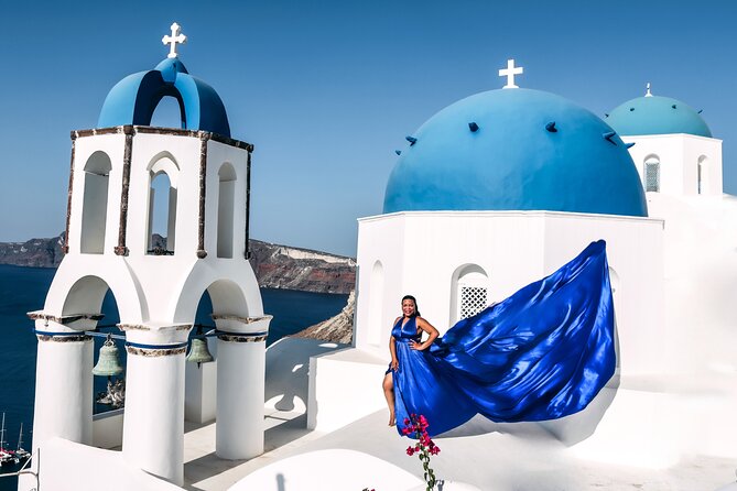 Exclusive Santorini Flying Dress Photoshoot with Pickup - Blue domes and caldera views in Imerovigli