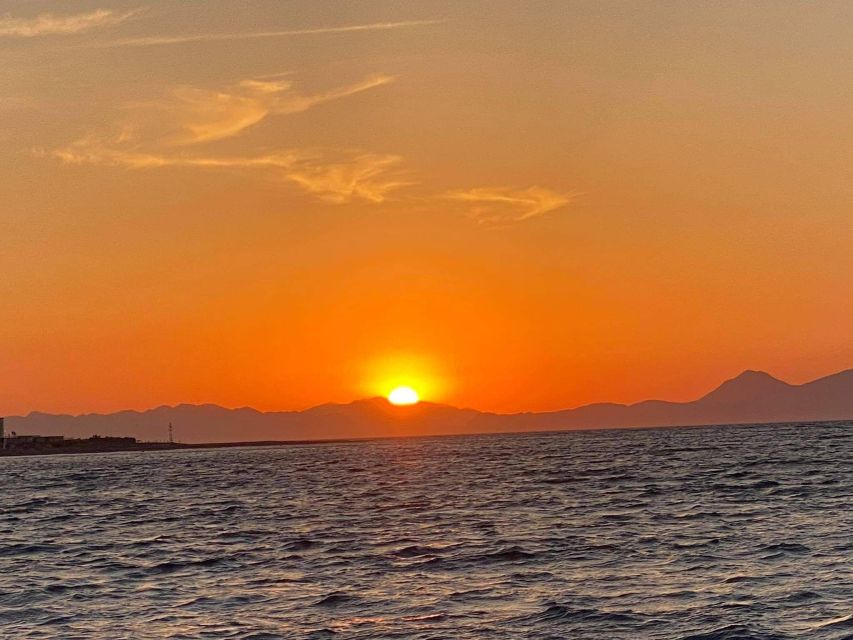 Faliraki: Evening RIB Cruise with Champagne and Sunset Views - Crossing Rhodes from the east coast to the west