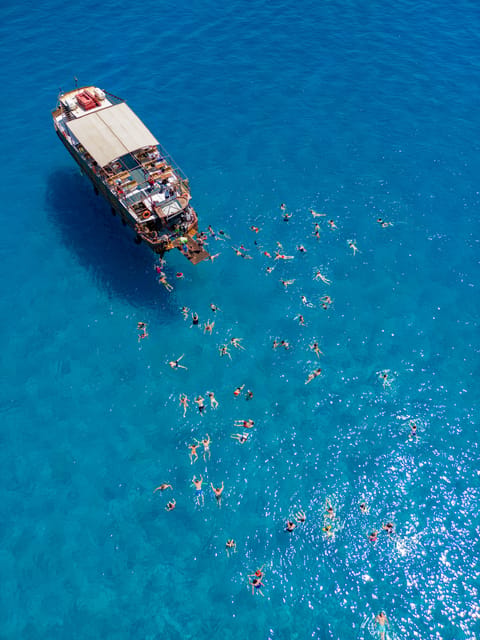 Faliraki : Transfer & Cruise to Lindos with 3 Swimming Stops - Reaching Lindos by boat at 10:15