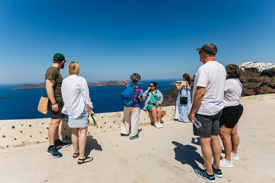 Fira: Guided Foodie Walking Tour with Tastings - Greek drinks, souvlaki, and everyday eating