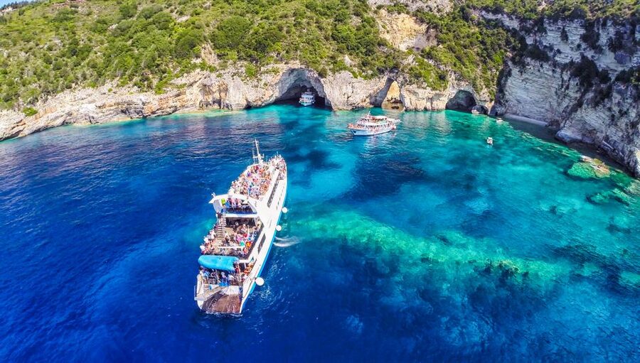 From Corfu: Day Cruise to Paxos, Antipaxos, and Blue Caves - Guides, Crew, Music, and the Mood on Board