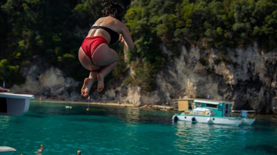From Lefkimmi: Evening Boat Trip to Sivota & Blue Lagoon - Greek music and the feel of a kaiki