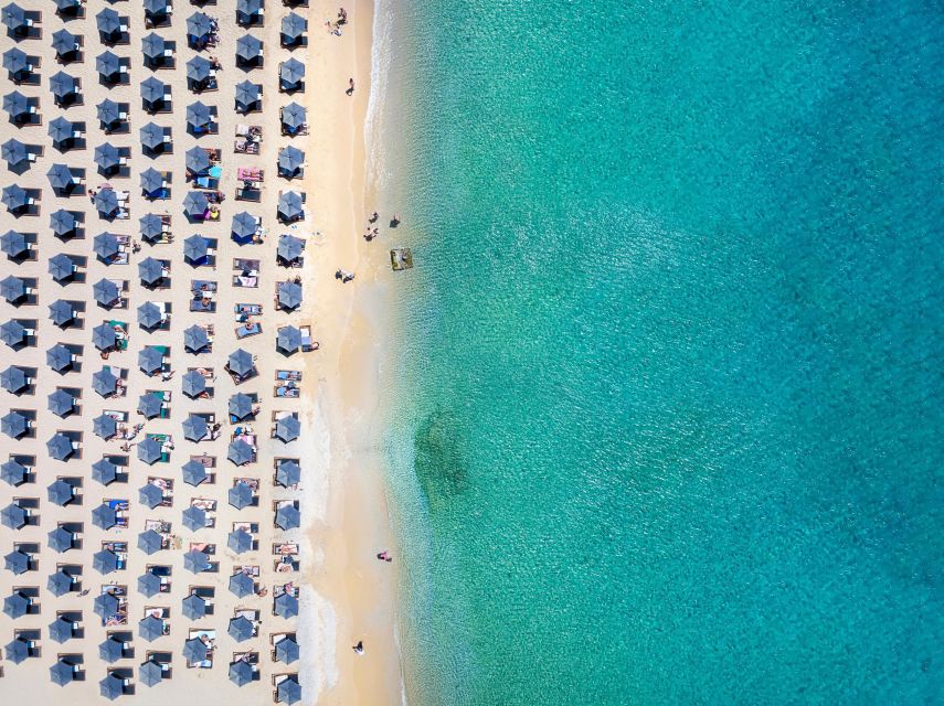 From Mykonos Cruise Port: Old Town Visit and Beach Getaway - Shops, cafés, and unplanned wandering