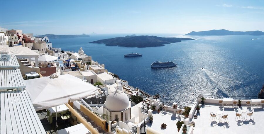 From Naxos: Full-Day Boat Trip to Santorini - Arriving at Athinios Port and seeing the caldera