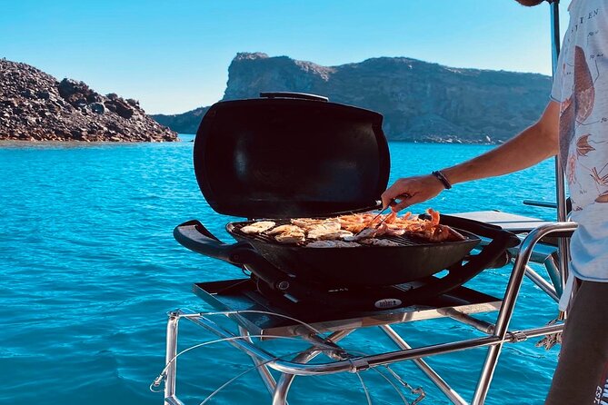 Half-Day Exclusive Catamaran Cruise in Santorini with Meal and Open Bar - Sunset sailing: beautiful, with one practical warning