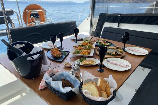 Half Day Premium Catamaran Cruise in Santorini including Oia - The Venetian lighthouse and the best photo moments