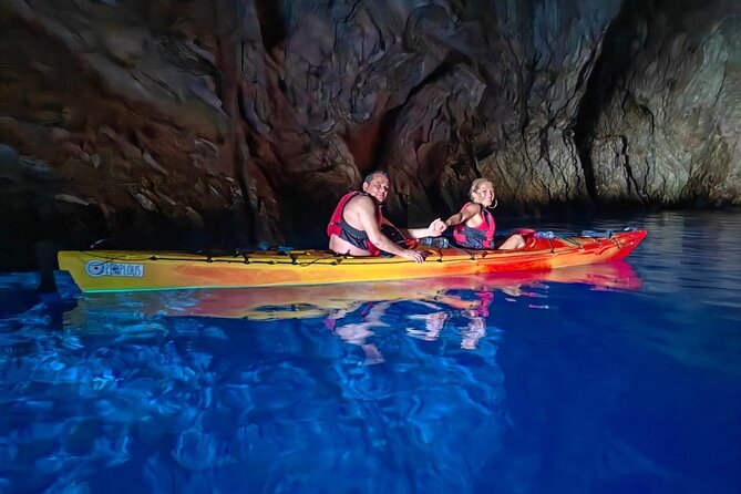 Kayak Trip to Hidden blue Cave, with lunch & fruits. - Entering the Blue Cave by kayak