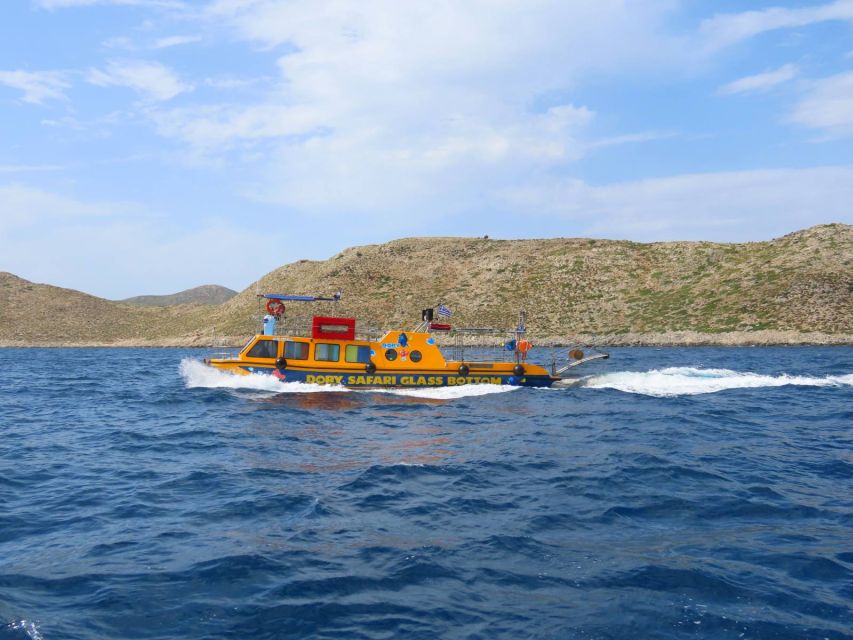 Kos Town: Glass-Bottom Boat Cruise with Swimming Stops - Boarding the yellow Dorry in Kos Town