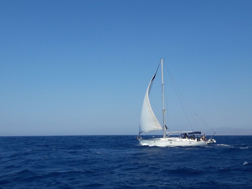 Mykonos: Delos and Rhenia Full-Day Sailing Cruise with Meal - From Mykonos New Port to the open Aegean