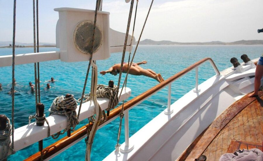 Mykonos: Sunset Party Boat Cruise with 1 Drink - Cruising the north coast by wooden boat