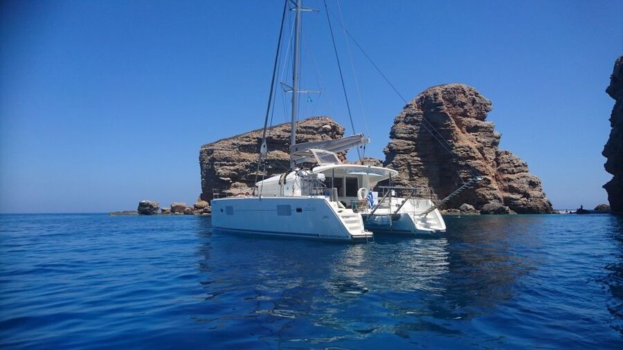 Naxos: Catamaran Cruise with Swim Stops, Food, and Drinks - Swimming and snorkeling at secluded coves