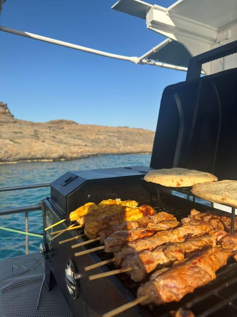 Porto Rafti: Athens Cruise Tour with Mediterranean BBQ - Swimming and snorkeling: what the day is really about
