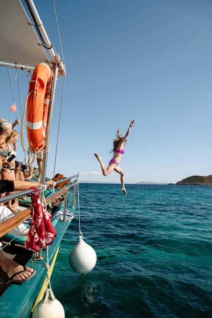 Porto Rafti: Athens East Attica Hidden Gems Cruise - Leaving Porto Rafti on a wooden boat