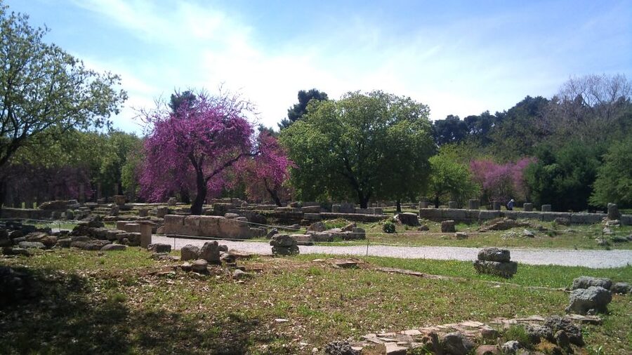 Private Guided Tour of Ancient Olympia - Running across the ancient Olympic stadium