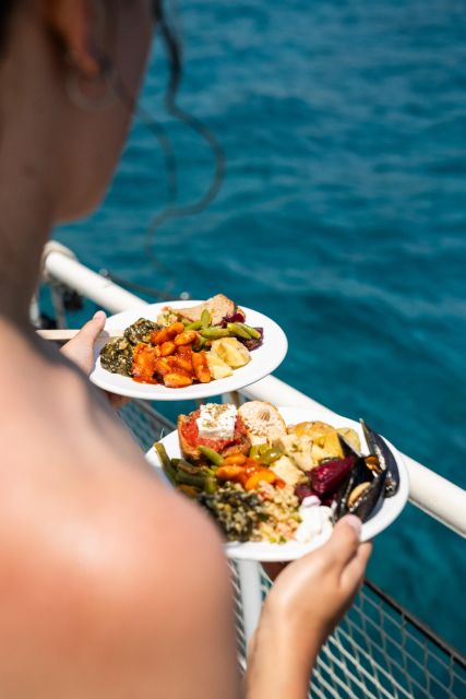 Rhodes: Bay to Bay Swim Cruise with Greek Buffet and Wine - Two decks, music, and the parea spirit