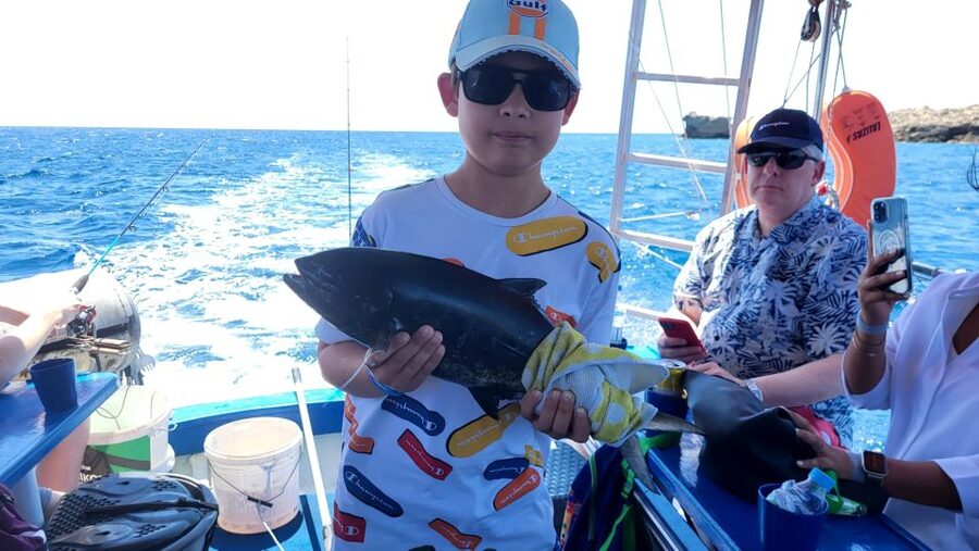 Rhodes: Fishing Trip, Snorkelling, BBQ, & Professional Guide - Comfort and safety on the wooden boat