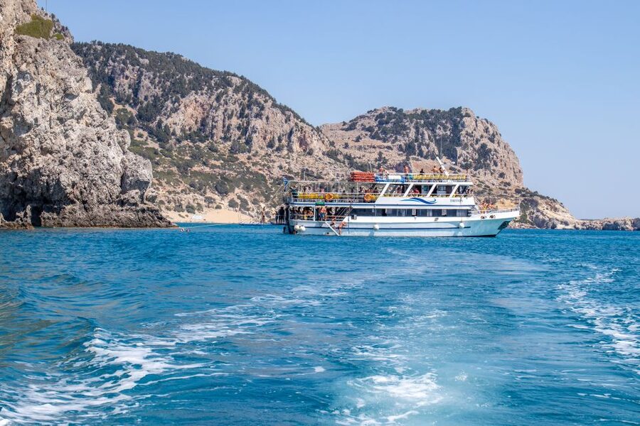 Rhodes: Full Day East Coast Bay to Bay Boat Trip with Lunch - Afandou combines a rocky shore with a cave