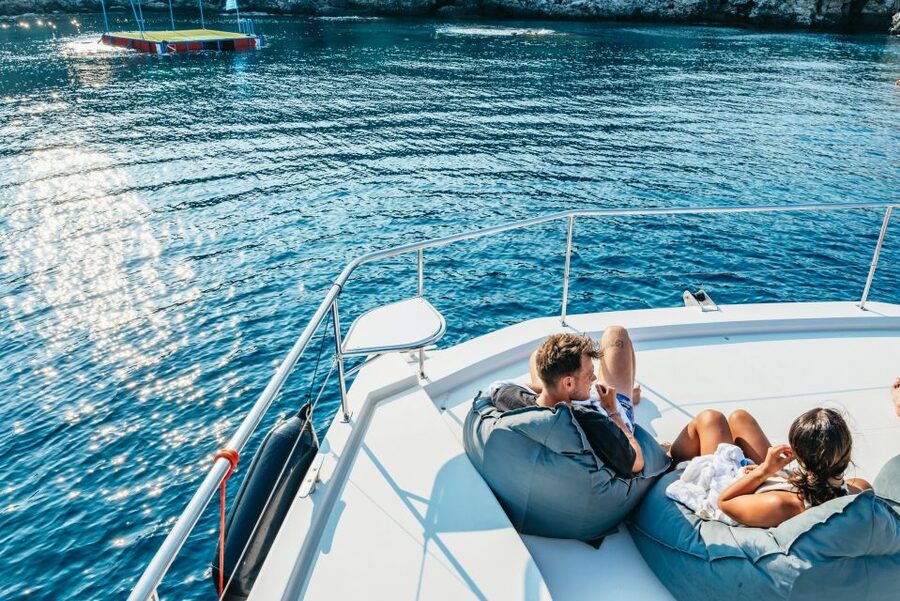 Rhodes: Sunset Catamaran Cruise with Dinner Buffet & Drinks - Leaving Mandraki Harbor on a three-hour cruise