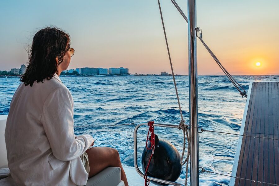 Rhodes: Sunset Catamaran Cruise with Dinner Buffet & Drinks - Music, open water, and the sunset return