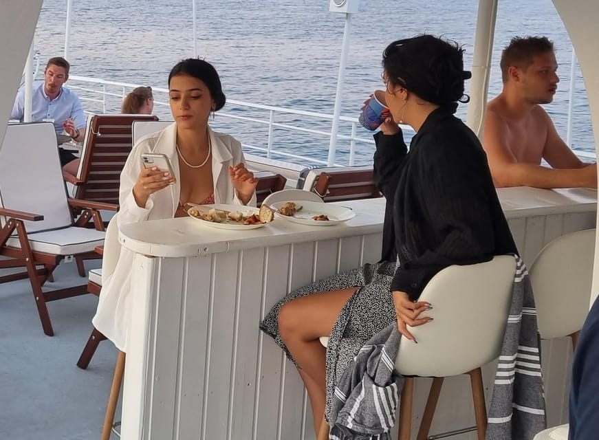 Rhodes: Sunset Cruise with Live Music, Wine & Greek Buffet - Kallithea Springs and the last swim of the day