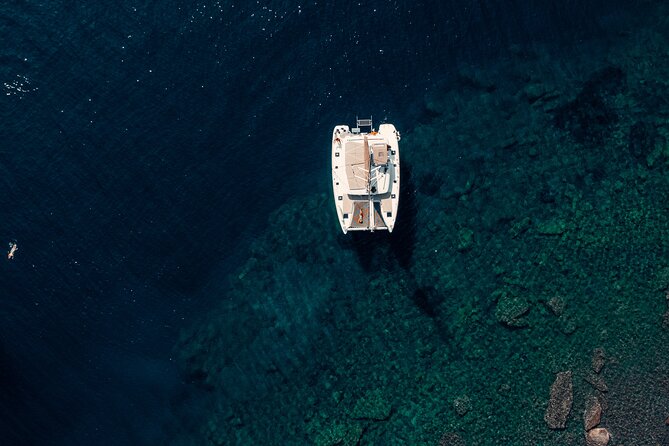 Romantic Sunset Catamaran Caldera Cruise incl. Meal & Drinks - Red Beach: a scenic first look