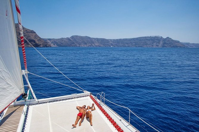 Sailing Catamaran Cruise in Santorini with BBQ, Drinks and Transfer - White Beach, barbecue, and the longest stop