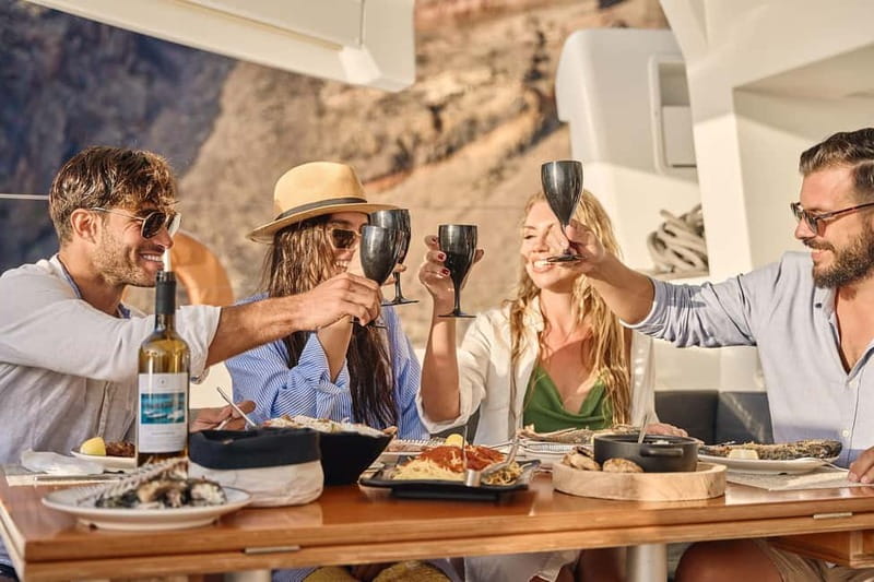 Santorini: Caldera Classic Catamaran Cruise w/ Meal & Drinks - Red Beach and the first swim