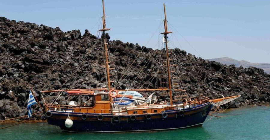 Santorini Caldera: Sunset Cruise with Dinner - Sailing beneath Oia before the final sunset