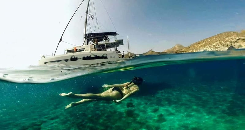 Santorini: Catamaran Cruise with Fresh Meal & Open Bar - Akrotiri Lighthouse and the southern caldera