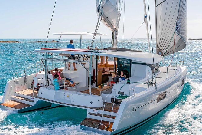 Santorini Catamaran Cruise with Greek Meal, Open-Bar and Sunset - Leaving the marina with the caldera in view