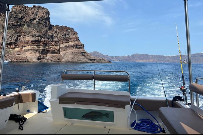 Santorini Fishing Private Cruise boat tour - BBQ, Snorkeling - Starting at Ammoudi Bay and heading toward the volcano