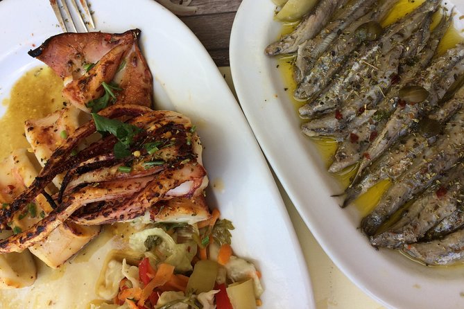 Santorini Food Tour: Fira Half-Day Small-Group Tour with Tastings - The tavern meal with a caldera view