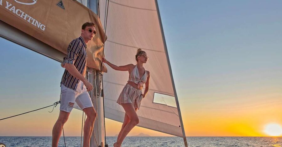 Santorini Gold Catamaran Cruise with Snorkel, BBQ & Open Bar - Red Beach, red cliffs, and Greek meze
