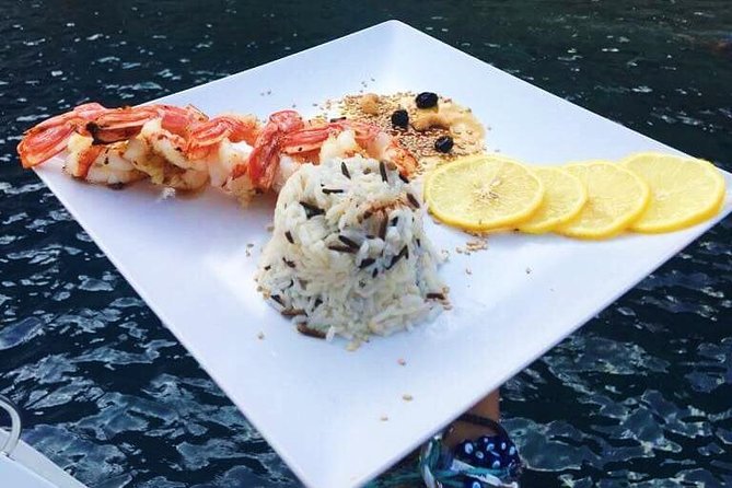 Santorini Luxury Catamaran Sunset Cruise with BBQ, Drink and Transfer - Why seeing Santorini from a catamaran makes sense