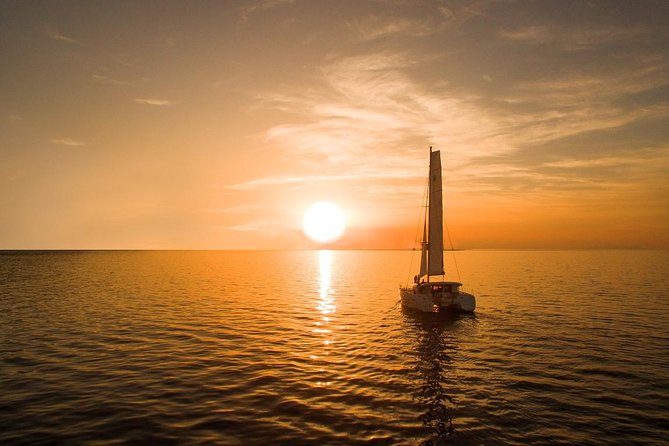 Santorini Luxury Catamaran Sunset Cruise with BBQ, Drink and Transfer - White Beach and the Greek barbecue
