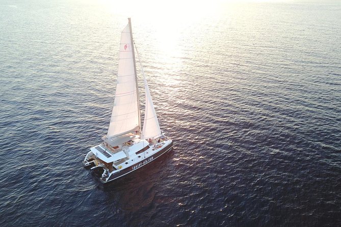 Santorini Luxury Catamaran Sunset Cruise with BBQ, Drink and Transfer - Sailing past the Volcano and Palea Kameni
