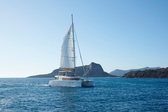 Santorini Platinum Catamaran Cruise with Meal, BBQ and Open Bar - White Beach and the Akrotiri lighthouse