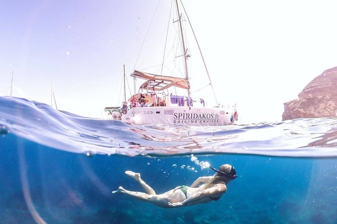 Santorini Private Catamaran Cruise with BBQ, Open Bar & Transfers - From Hotel Pickup to Vlychada Port