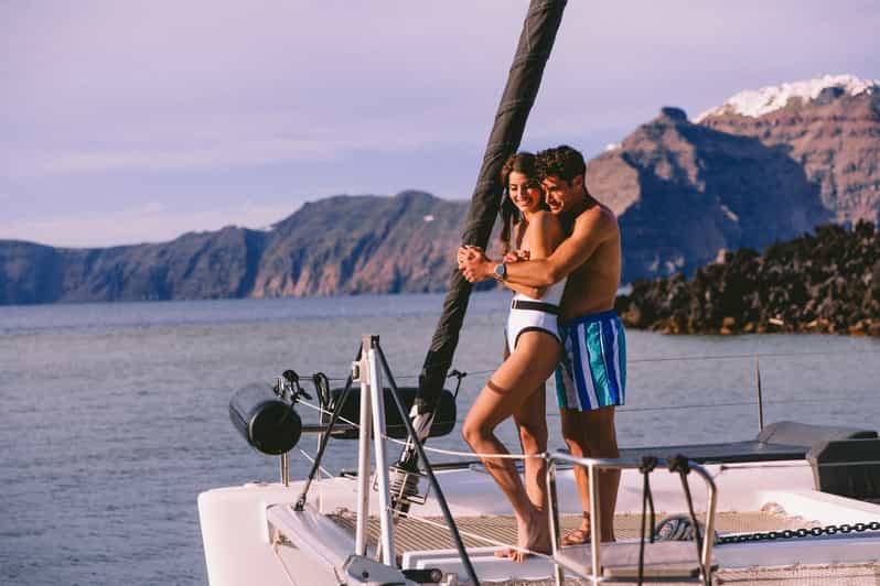 Santorini: Private Catamaran Tour with BBQ Meal and Drinks - Swimming at Mesa Pigadia and the black volcanic coast