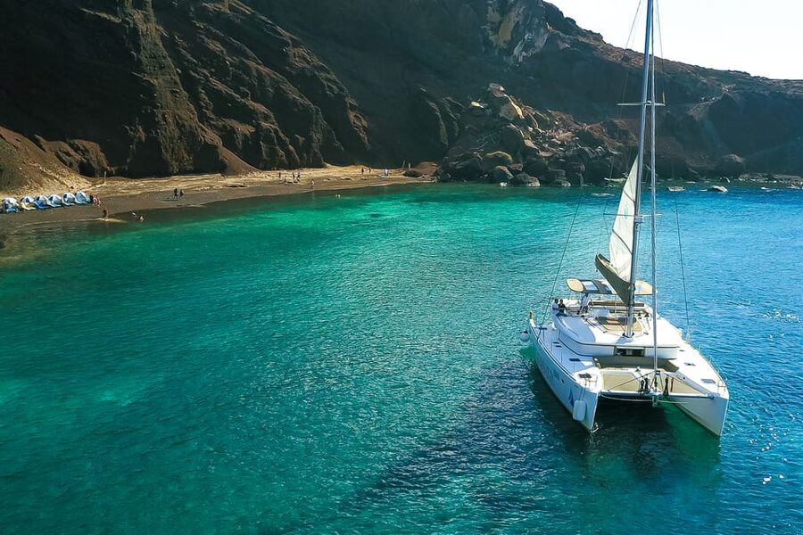 Santorini: Private Catamaran Tour with BBQ Meal and Drinks - Indian Rocks, the Venetian Lighthouse, and the caldera