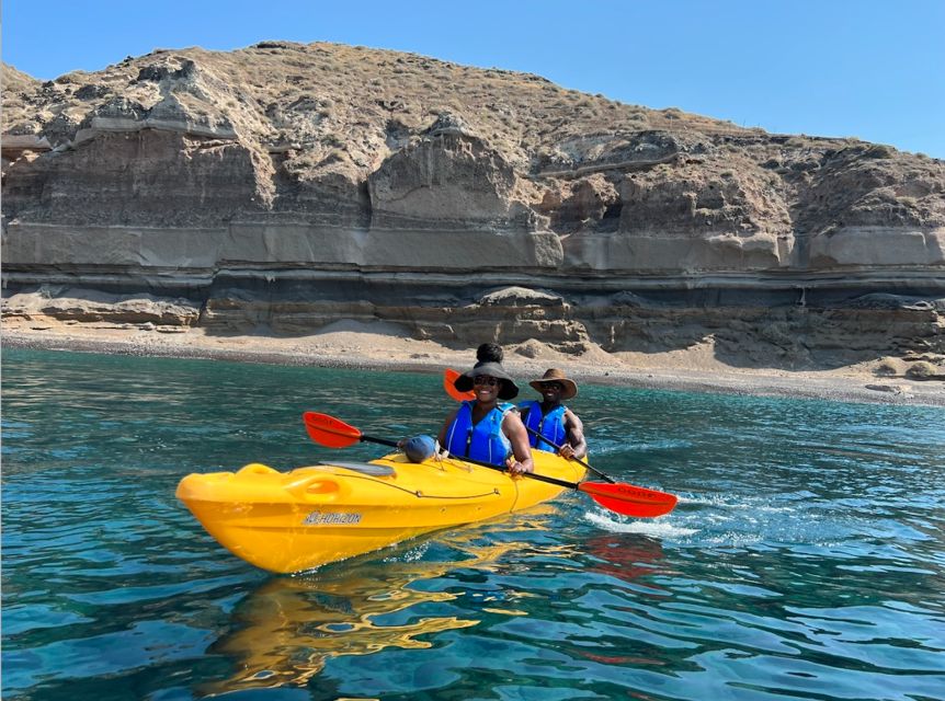 Santorini: Sea Caves Kayak Trip with Snorkeling and Picnic - White Beach and the cliff-jumping stop